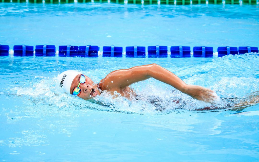 person swimming in body of water